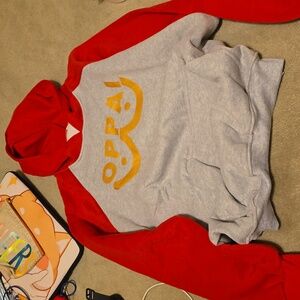 New gray and red sweater thst has the word oppai